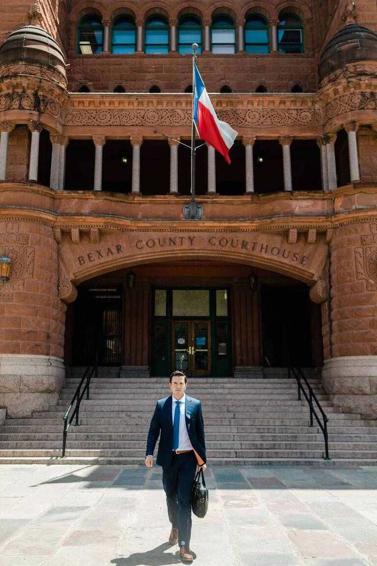 Attorney on the steps of the Bexar County Courthouse